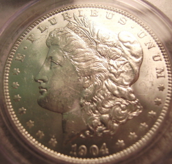 A-Coin-For-The-Hole-Club-To-Grade1904-Morgan